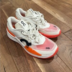 On Cloud White and Orange Sneakers